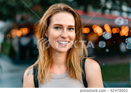 Portrait of a beautiful young woman outdoors Portrait of a beautiful young woman outdoors 92478802