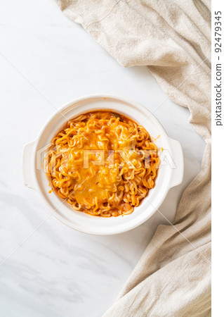 spicy instant noodle with cheese 92479345