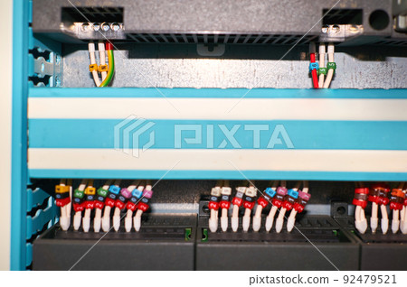 Black controller with connected colored numbered wires. Black controller with connected colored numbered wires. 92479521