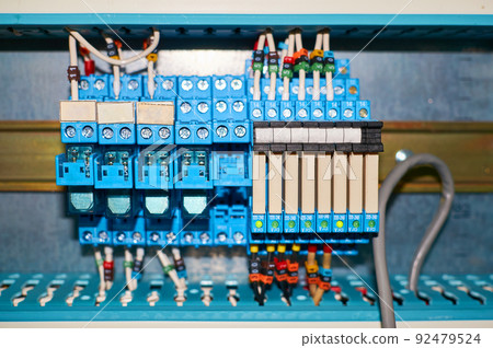 Blue relay with numbered colored wires connected. 92479524