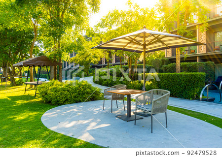 empty outdoor patio chair in garden 92479528