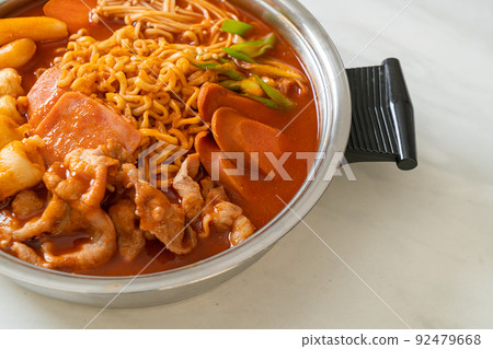 Budae Jjigae or Budaejjigae (Army stew or Army base stew). It is loaded with Kimchi, spam, sausages, ramen noodles and much more Budae Jjigae or Budaejjigae (Army stew or Army base stew). It is loaded with Kimchi, spam, sausages, ramen noodles and much more 92479668