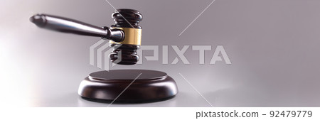 Wooden judge gavel on a gray background Wooden judge gavel on a gray background 92479779