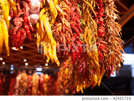 sweet and hot dried peppers bunches on market 92481719