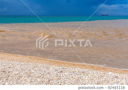 Muddy water of Belbek river mixed with blue seawater 92483116