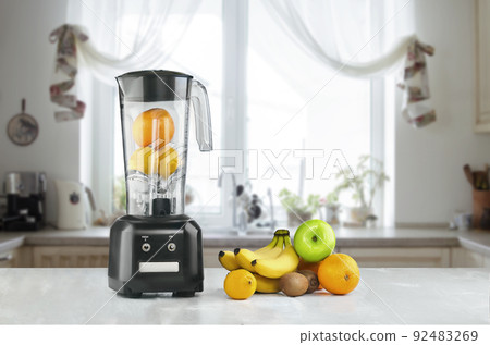 Blender and fruits on kitchen space 92483269