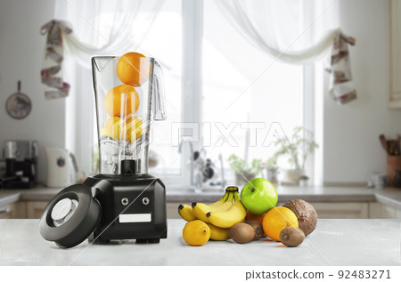 Blender and fruits on kitchen space 92483271