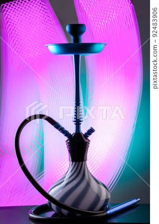 Blue eastern hookah on colorful background 92483906