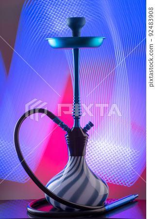Blue eastern hookah on colorful background 92483908