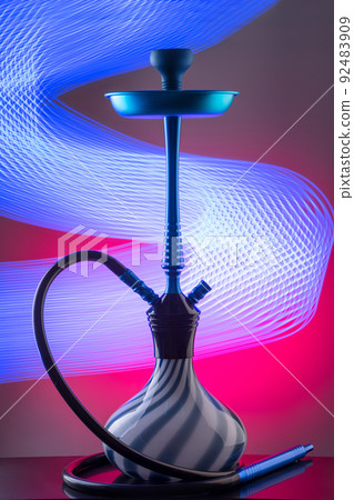 Blue eastern hookah on colorful background 92483909