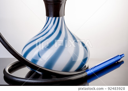 Flask of hookah view close-up. Eastern hookah on white background Flask of hookah view close-up. Eastern hookah on white background 92483928
