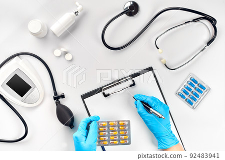 Doctor s table, tools, medical instruments, therapist tonometer, blood pressure, work in hospital on white background flat lay Doctor s table, tools, medical instruments, therapist tonometer, blood pressure, work in hospital on white background flat lay 92483941