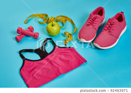 Sneakers, centimeter, green apple, weight loss, running, healthy eating, healthy lifestyle concept 92483971