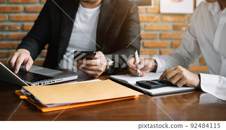 Businessman, administrator, financial audit and secretary making reports, calculating balance. Income audit service within audit concept. Businessman, administrator, financial audit and secretary making reports, calculating balance. Income audit service within audit concept. 92484115