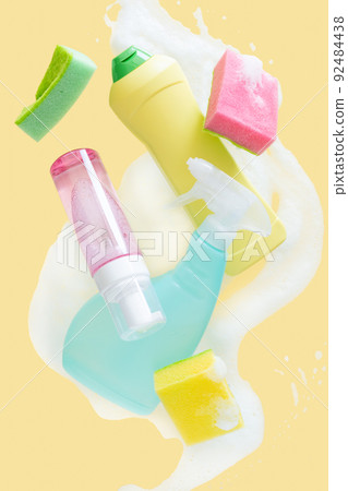 Cleaning concept - velitation of cleaning supplies on pastel background Cleaning concept - velitation of cleaning supplies on pastel background 92484438
