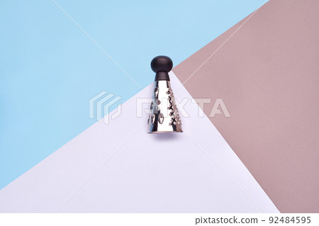 A small metal grater products on colorful background A small metal grater products on colorful background 92484595