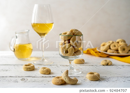 Sweet Italian cookies Taralli made with white wine, sugar, olive oil, eggs and flour 92484707