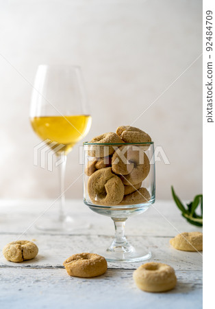 Sweet Italian cookies Taralli made with white wine, sugar, olive oil, eggs and flour Sweet Italian cookies Taralli made with white wine, sugar, olive oil, eggs and flour 92484709