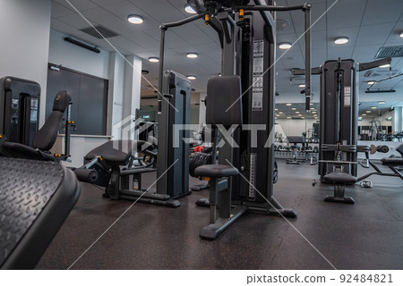 Modern light gym. Sports equipment in gym. Modern light gym. Sports equipment in gym. 92484821