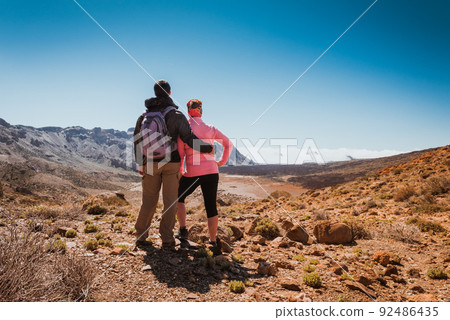 sporty couple on top of mountain. Tenerife Canary sporty couple on top of mountain. Tenerife Canary 92486435