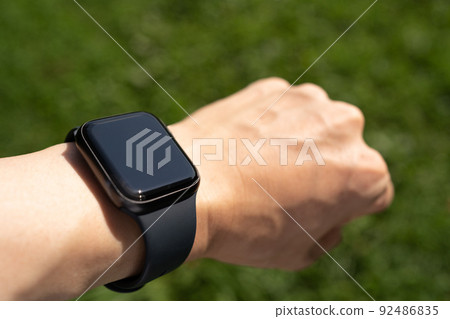 Arm of a man wearing a smartwatch Arm of a man wearing a smartwatch 92486835