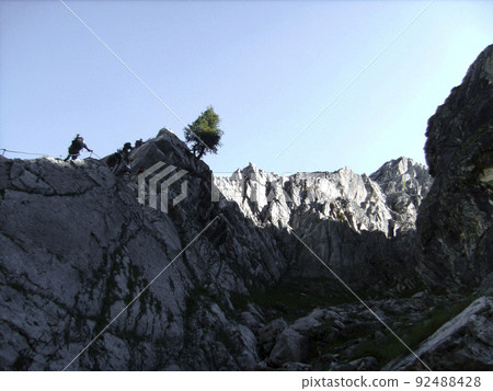 Via ferrata at high mountain lake Seebensee, Tajakopf mountain, Tyrol, Austria Via ferrata at high mountain lake Seebensee, Tajakopf mountain, Tyrol, Austria 92488428