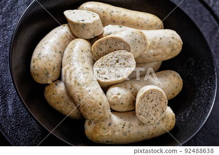 Weisswurst, white sausage of minced veal and pork Weisswurst, white sausage of minced veal and pork 92488638