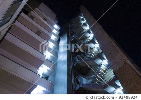 Exterior of the illuminated apartment at night Exterior of the illuminated apartment at night 92488924