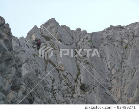 Via ferrata at high mountain lake Seebensee, Zugspitze mountain, Tyrol, Austria Via ferrata at high mountain lake Seebensee, Zugspitze mountain, Tyrol, Austria 92489271