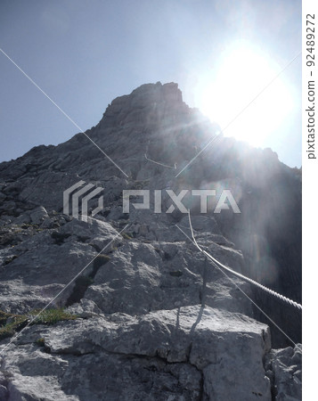 Via ferrata at high mountain lake Seebensee, Zugspitze mountain, Tyrol, Austria Via ferrata at high mountain lake Seebensee, Zugspitze mountain, Tyrol, Austria 92489272