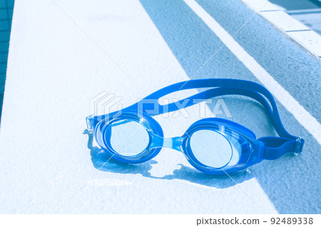 Blue goggles on white background Blue goggles on white background 92489338