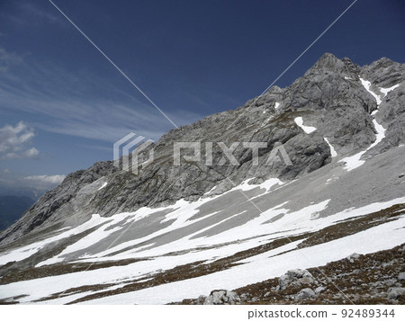 Via ferrata at high mountain lake Seebensee, Zugspitze mountain, Tyrol, Austria Via ferrata at high mountain lake Seebensee, Zugspitze mountain, Tyrol, Austria 92489344