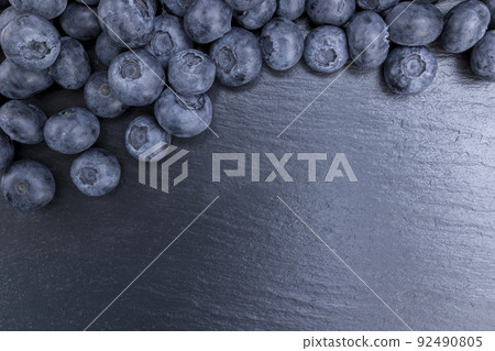 Fresh blueberries summer fruits for a healthy diet on stone background Fresh blueberries summer fruits for a healthy diet on stone background 92490805