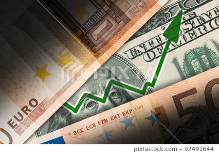 Business and finance. Dollar and euro banknotes with a green growth arrow, close-up. Flat lay. The concept of the global economic, investment and stock trading Business and finance. Dollar and euro banknotes with a green growth arrow, close-up. Flat lay. The concept of the global economic, investment and stock trading 92491644