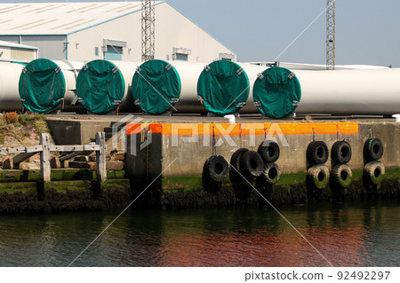 Wind Turbine Sections Stored at a Coastal Port Location Wind Turbine Sections Stored at a Coastal Port Location 92492297