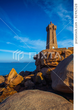 Lighthouse on the Pink Granite Coast, Ploumanach, Brittany, France Lighthouse on the Pink Granite Coast, Ploumanach, Brittany, France 92492528