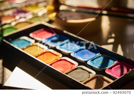 watercolor paints are laid out on the table watercolor paints are laid out on the table 92493070