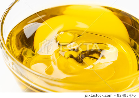 Shaking and rippling olive oil Shaking and rippling olive oil 92493470