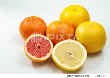 Grapefruit on a white background_Sliced white and ruby Grapefruit on a white background_Sliced white and ruby 92494035