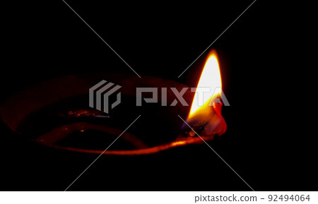 Traditional oil lamp on dark background with copy space. 92494064