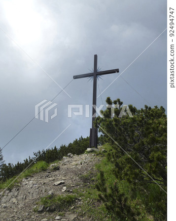 Summit cross Ochsensitz mountain, Ammergau Alps, Germany Summit cross Ochsensitz mountain, Ammergau Alps, Germany 92494747