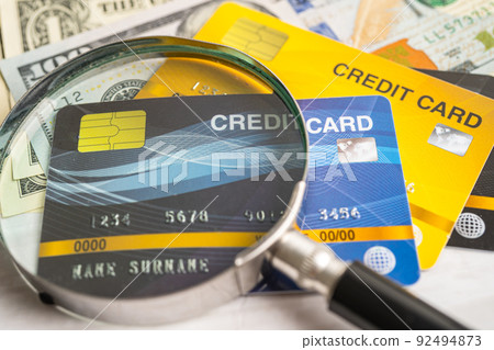 Credit card on US dollar banknotes. Finance development, Banking Account, Statistics, Investment Analytic research data economy, Stock exchange trading, Business company concept. Credit card on US dollar banknotes. Finance development, Banking Account, Statistics, Investment Analytic research data economy, Stock exchange trading, Business company concept. 92494873