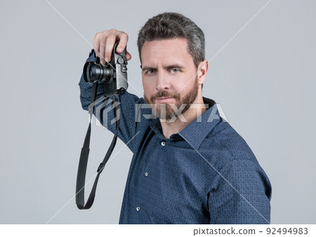 Photography is my hobby. Unshaven man hold photo camera. Hobby concept Photography is my hobby. Unshaven man hold photo camera. Hobby concept 92494983