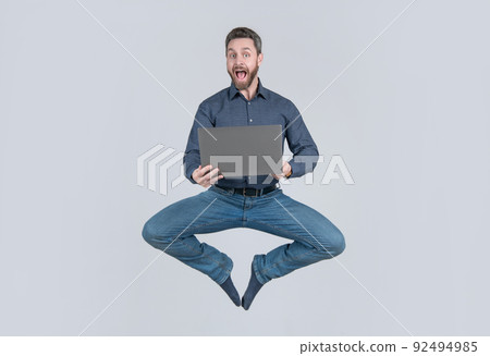 jumping businessman working online. success. programmer man use pc. jumping businessman working online. success. programmer man use pc. 92494985
