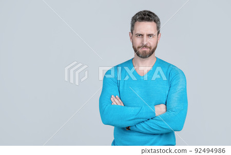 handsome man in casual wear has grizzled hair. successful man on grey background. 92494986