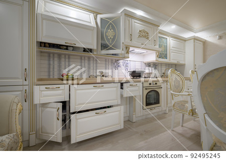 Renovated Interior of rich classic white kitchen 92495245