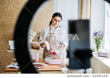 Side Hustle Ideas to Make Money, Culinary online courses. Asian Arabic woman pastry chef Side Hustle Ideas to Make Money, Culinary online courses. Asian Arabic woman pastry chef 92495259