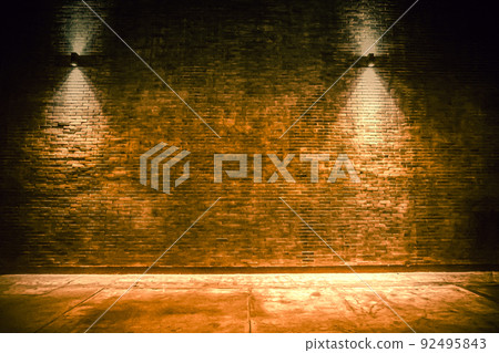 old room with brick wall, grungy background . brick wall with bulb lights lamp. nice brick show room with spotlights. Background of an empty corridor with brick wall old room with brick wall, grungy background . brick wall with bulb lights lamp. nice brick show room with spotlights. Background of an empty corridor with brick wall 92495843