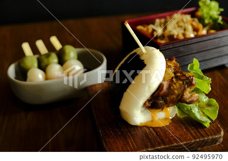 Hirata buns.  Japanese steamed buns filled with pork chashu, tempura, karaage. Japanese traditional food 92495970