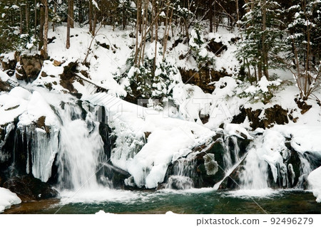 A small active waterfall. Clean mountain stream, snowy winter landscape, wildlife background A small active waterfall. Clean mountain stream, snowy winter landscape, wildlife background 92496279